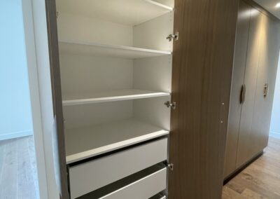 Large storage space and shelving in custom residential cabinets