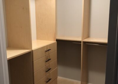 Custom storage solutions in a large walk in closet