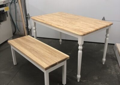 Photo of a small table and bench custom built by Steinegg Cabinets