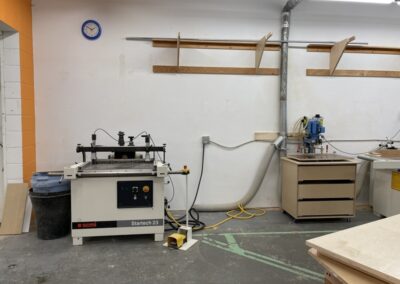 Machinery for building custom cabinets in the Steinegg Cabinets wood shop in Nelson BC